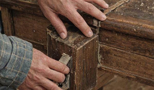 Furniture joint repair showing traditional woodworking techniques